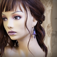 Handmade Iridescent Lucite Flower Earrings in Dark Color Shifting Purple, Fuchsia and Blue, with Gothic Victorian Style Black Metal Filigree photographed on a mannequin